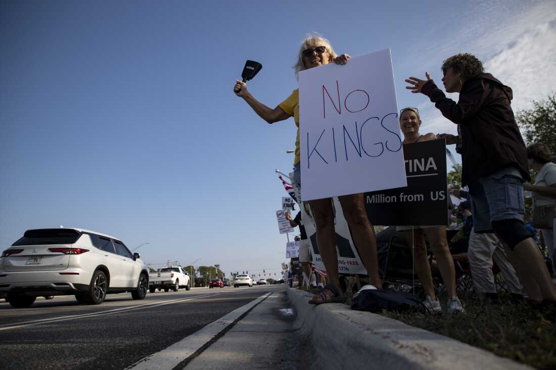 Demonstrators gather along U.S. route 41 in Fort Myers, Fla. for the No Kings III protest rally on Saturday.