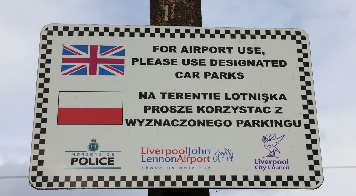 A sign asking airport users to park in the designated car park