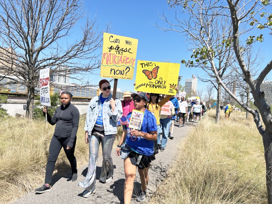 Attendees of the No Kings protest march around Railroad Park in Birmingham