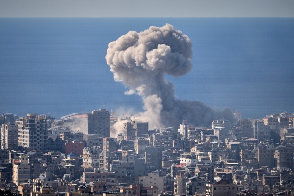 Smoke rises from an Israeli airstrike in Dahiyeh, Beirut's southern suburbs, March 9, 2026. (AP Photo/Hassan Ammar, File)