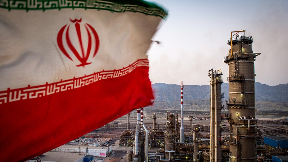 Iranian flag flies above oil refinery