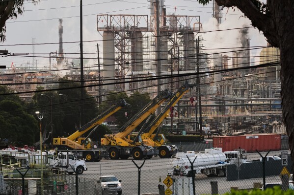 Tanker trucks are seen at the Chevron Products Company refinery, one of California's largest petroleum processing facilities, in El Segundo, Calif., on March 4, 2026. (AP Photo/Damian Dovarganes)