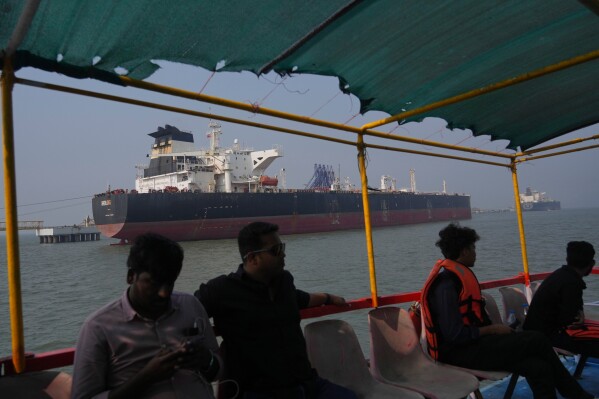 Liberia-flagged tanker Shenlong Suezmax, carrying crude oil from Saudi Arabia, that arrived clearing the Strait of Hormuz, is seen at the Mumbai Port in Mumbai, India, Thursday, March 12, 2026. (AP Photo/Rafiq Maqbool)
