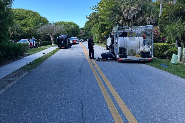 This photo provided by the Martin County Sheriff's Office shows skid marks near the overturned vehicle in a rollover crash which involved Tiger Woods in Jupiter Island, Fla., on Friday, March 27, 2026. (Martin County Sheriff's Office via AP)