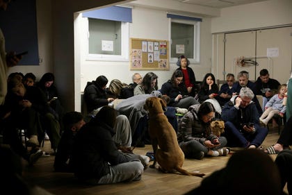 Israelis in Tel Aviv in a bomb shelter overnight into Wednesday, as Iran fires missiles at central Israel.