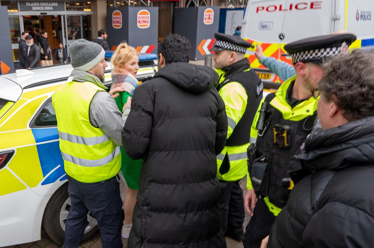 The newly elected MP was ushered into a police car amid the unfolding chaos