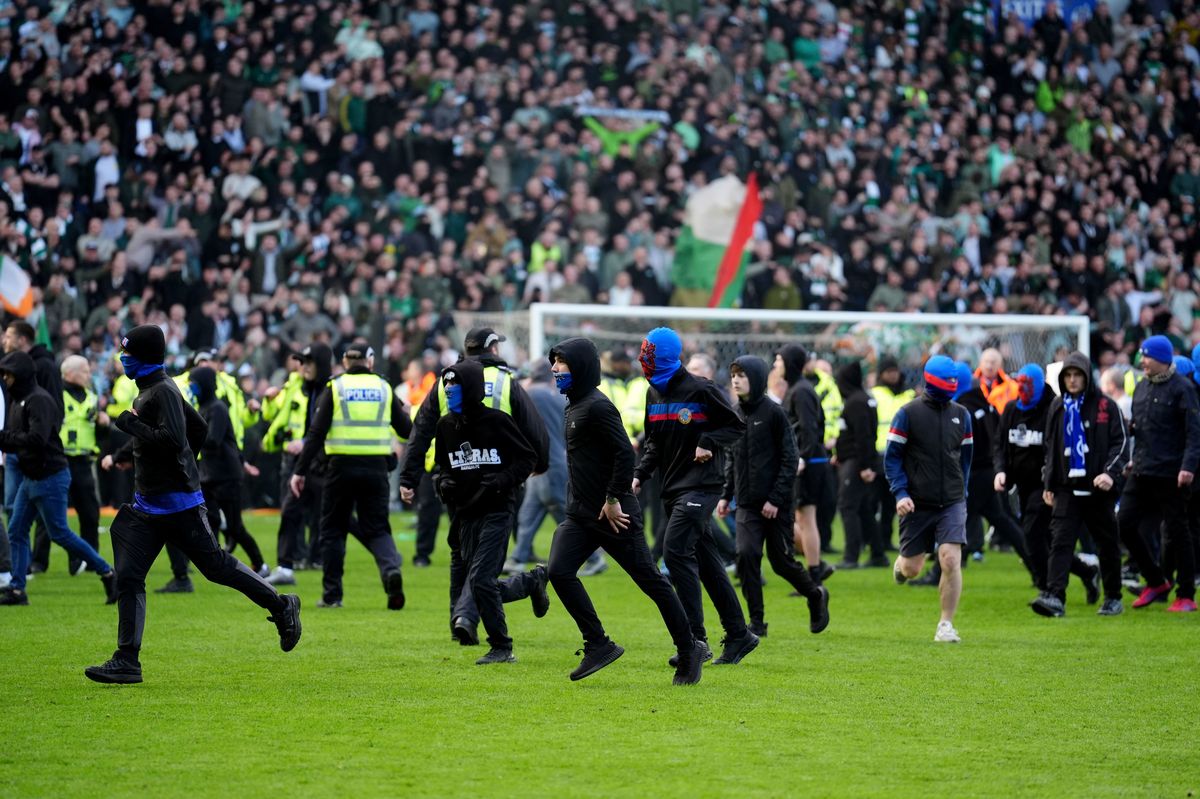 Pitch invasion after Celtic win on penalties after the Scottish Gas Men's Scottish Cup quarter-final match at Ibrox 