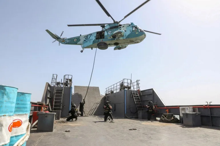 Members of the Iranian Army attend the joint Navy exercise of Iran and Russia in southern Iran, in this handout image obtained on February 19, 2026. Iranian Army/WANA (West Asia News Agency)/Handout via REUTERS ATTENTION EDITORS - THIS PICTURE WAS PROVIDED BY A THIRD PARTY. TPX IMAGES OF THE DAY