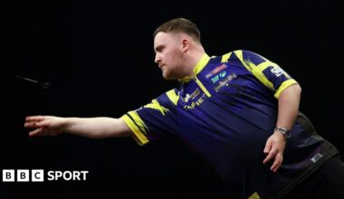 Stock picture of Luke Littler throwing a dart. The photograph is taken side-on.
