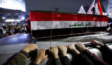 Mourners attend the funeral of members of Iraq's Hashid Shaabi, who were killed in an airstrike in the town of al‑Qaim nea...