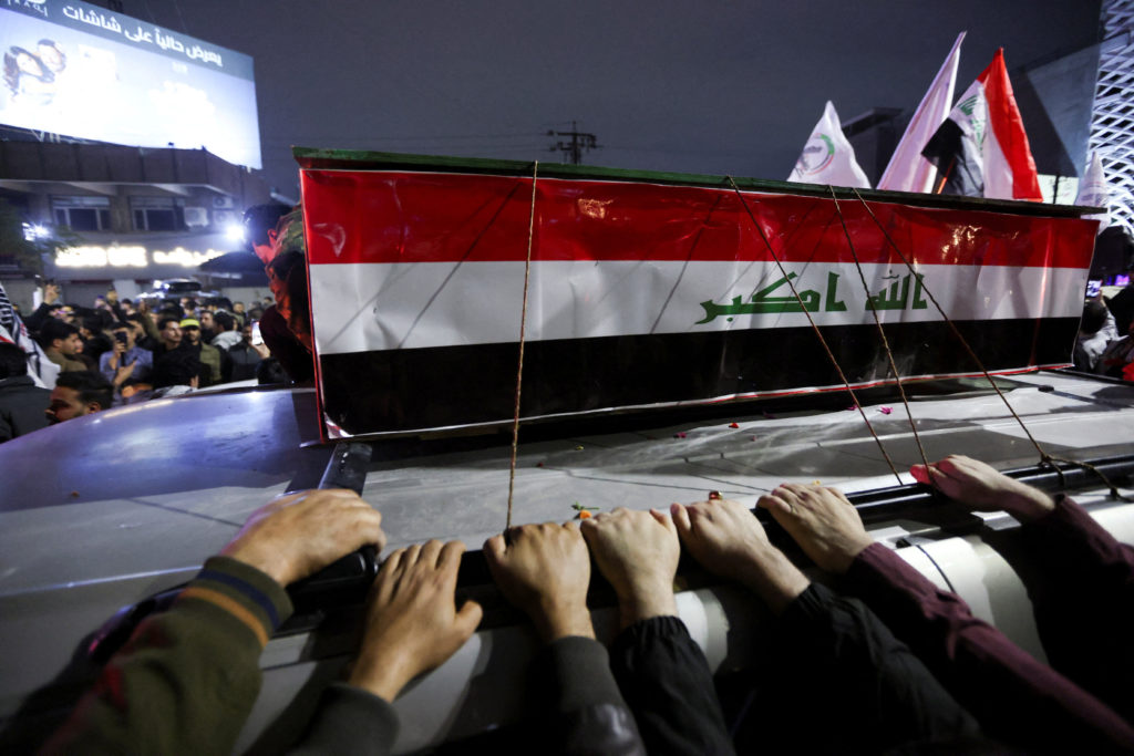 Mourners attend the funeral of members of Iraq's Hashid Shaabi, who were killed in an airstrike in the town of al‑Qaim nea...