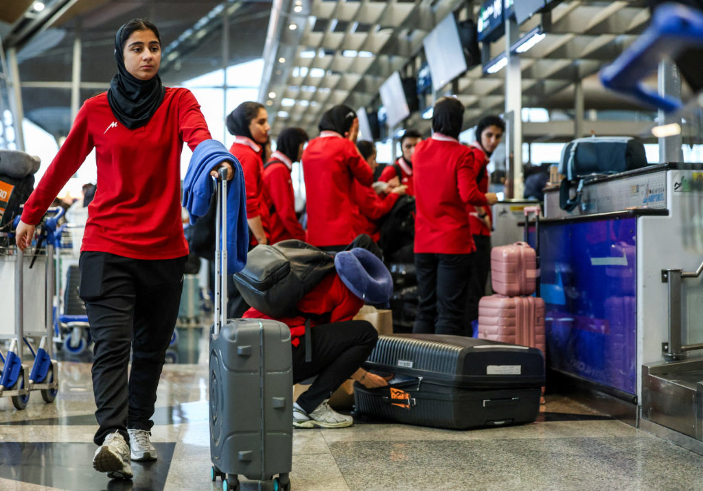 Members of the Iranian women’s national soccer team arrive at Kuala Lumpur International Airport