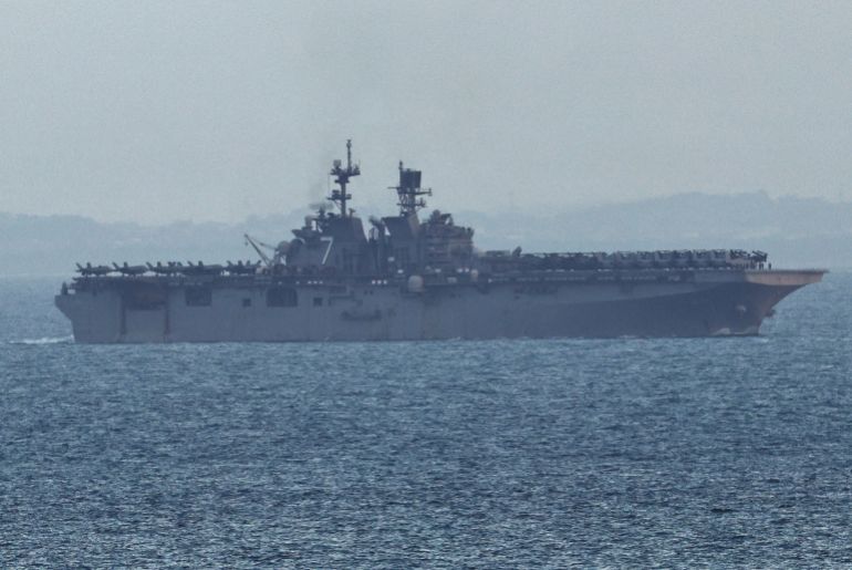 The USS Tripoli (LHA-7) amphibious assault ship enters the Singapore Straits, amid the U.S.-Israeli conflict with Iran, as seen from Singapore, March 17, 2026. REUTERS/Edgar Su