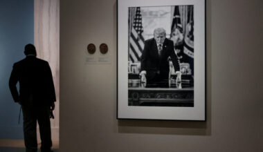 People view the portrait of U.S. President Donald Trump at the Smithsonian National Portrait Gallery in Washington