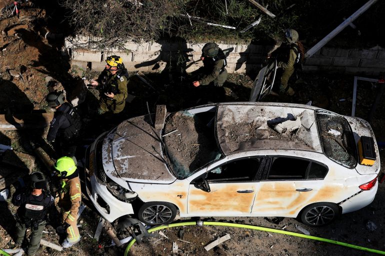 This picture shows damaged buildings at the site of an Iranian missile strike in Tel Aviv