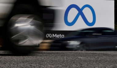 FILE PHOTO: Cars drive past a sign of Meta, the new name for the company formerly known as Facebook, at its headquarters i...