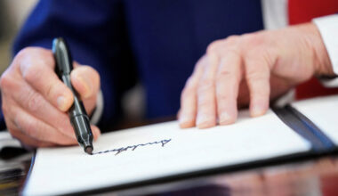 FILE PHOTO: U.S. President Donald Trump signs executive orders at the White House