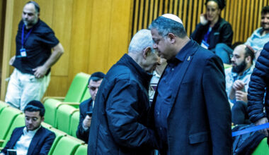 Israeli Prime Minister Benjamin Netanyahu and Israel's far-right National Security Minister Itamar Ben-Gvir shake hands as...