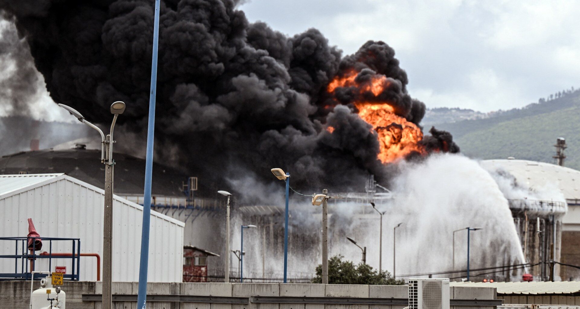 Fire contained after missile attack on oil refinery in Israel’s Haifa | Israel attacks Lebanon News