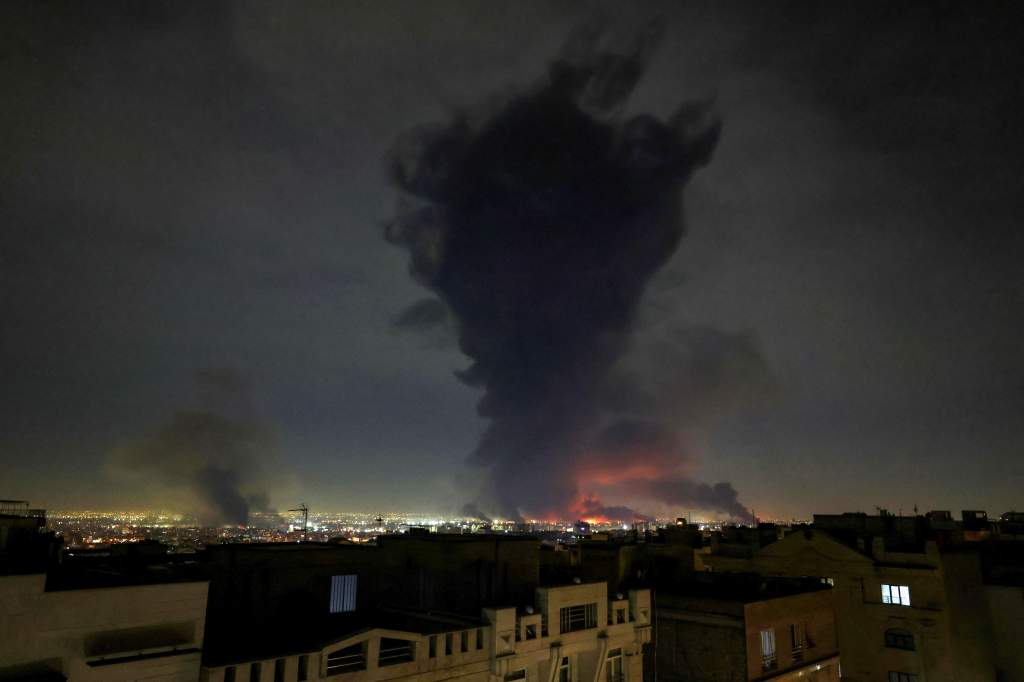 Smoke rises from the site of airstrikes at Mehrabad International Airport in Tehran on March 7, 2026. Israel said on March 7