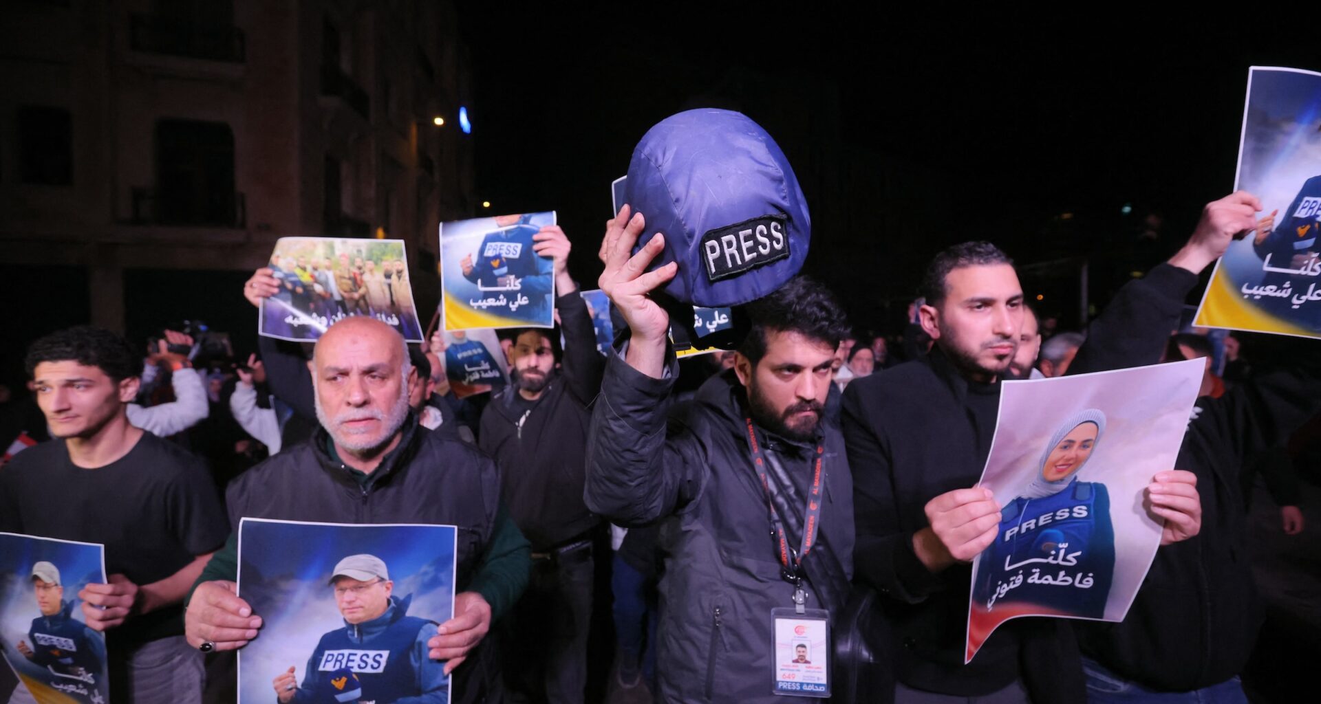 People hold pictures of Fatima Ftouni and Ali Shoaib in downtown Beirut, as they protest their killing from an Israeli strike that targeted their vehicle on a road leading to Jezzine in southern Lebanon on March 28, 2026.