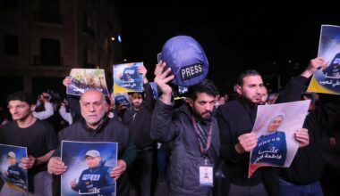 People hold pictures of Fatima Ftouni and Ali Shoaib in downtown Beirut, as they protest their killing from an Israeli strike that targeted their vehicle on a road leading to Jezzine in southern Lebanon on March 28, 2026.