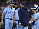 Manager John Schneider #14 of the Toronto Blue Jays walks to the mound to talk to Max Scherzer #31 during the fifth inning against the Seattle Mariners in game four of the American League Championship Series at T-Mobile Park on October 16, 2025 in Seattle.