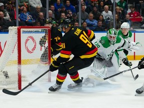 Evander Kane #91 of the Vancouver Canucks scores on Jake Oettinger #29 of the Dallas Stars during the first period at Rogers Arena on March 2, 2026 in Vancouver, British Columbia, Canada.