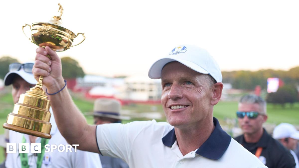 Luke Donald holds aloft the Ryder Cup trophy at Bethpage Black in 2025