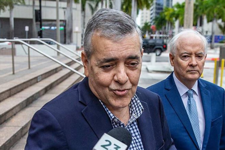 David Rivera talks to reporters outside the courthouse