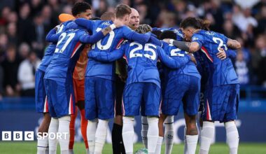 Paul Tierney caught in the middle of Chelsea's pre-match huddle