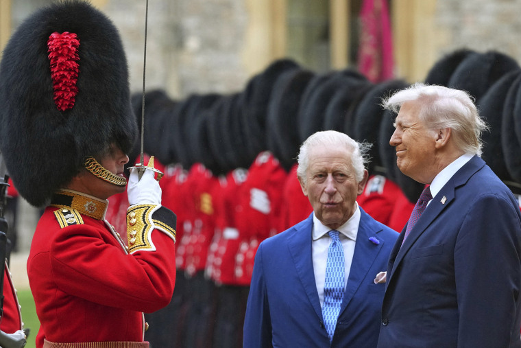 President Donald Trump and Britain's King Charles III inspect a Guard of Honour during in the Quadrangle at Windsor Castle, in Windsor, on September 17, 2025.
