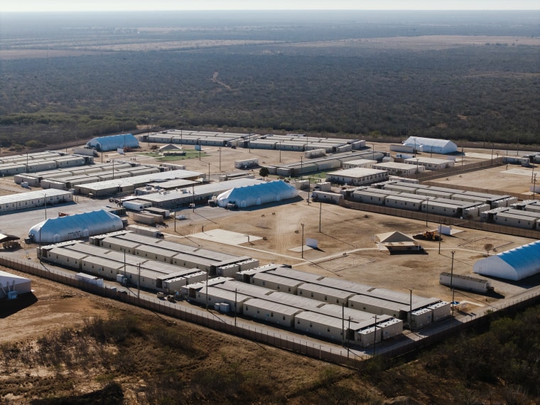An aerial photo of a government detention center inside a barbed wire perimeter. 