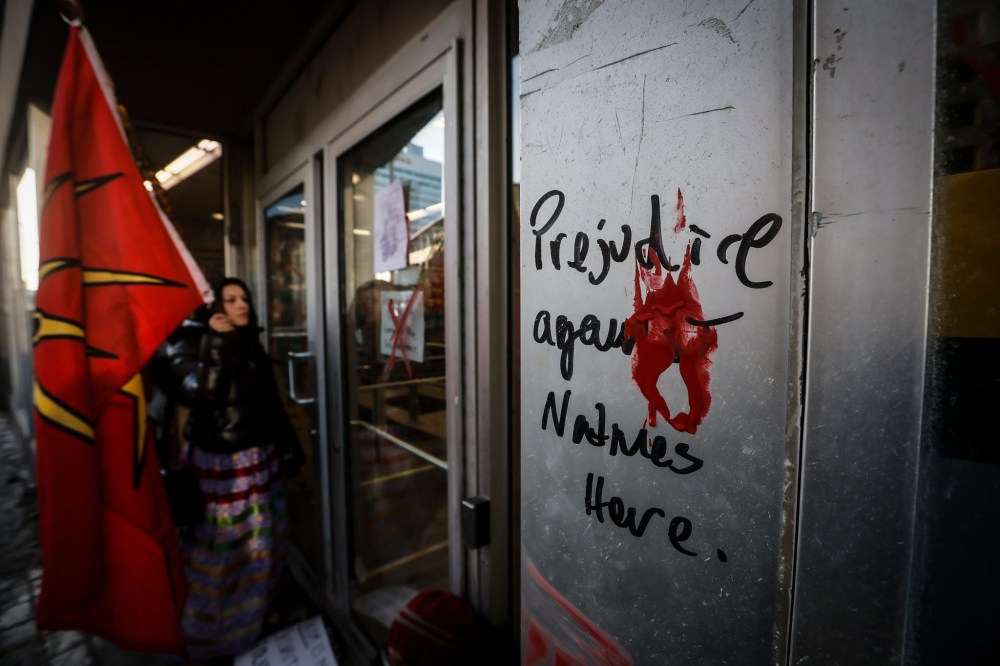 JOHN WOODS / FREE PRESS
People protest outside the Dollarama on Portage Avenue on Monday afternoon.