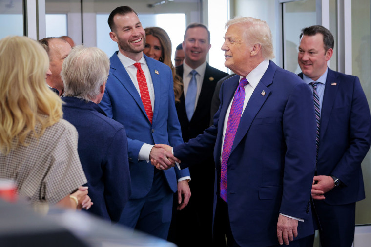 President Donald Trump shakes hands with Republican congressional candidate Clay Fuller 