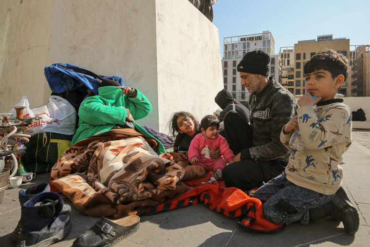 03 March 2026, Lebanon, Beirut: A  family takes refuge in downtown Beirut on March 3,m 2026, after fleeing their home in the city's southern suburbs. 