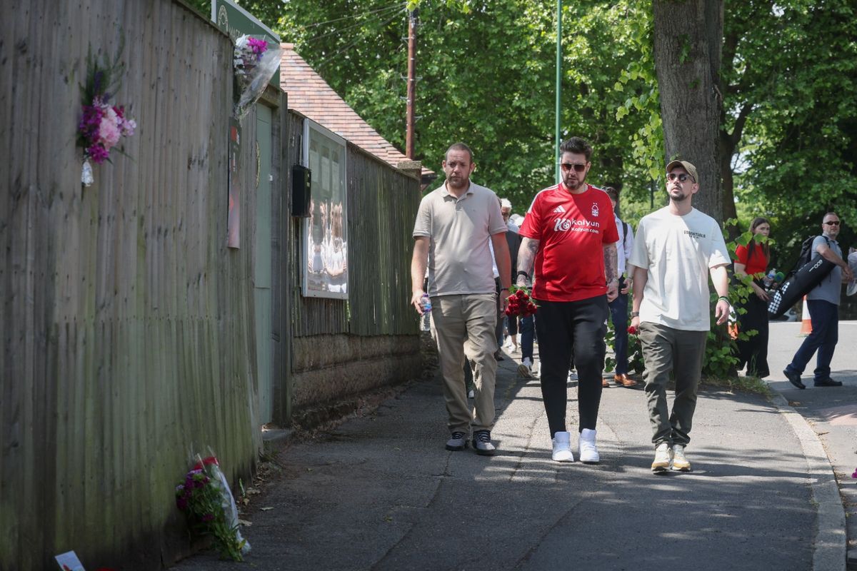 Photo shows Darren Coates, James Coates and Lee Coates paying tribute in Magdala Road, Mapperley Park, on the second anniversary of the Nottingham attacks 