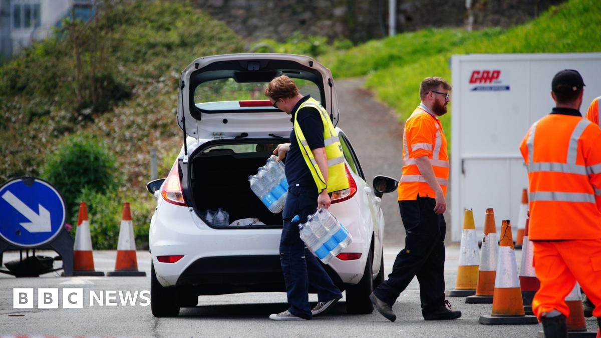 A shot of a car queuing to collect packs of bottled water at Freshwater car park in Brixham after a Boil Water Notice was issued. Households and businesses were advised not to use their tap water without boiling it first OR to use bottled water instead after traces of cryptosporidium were found in the water supply network
