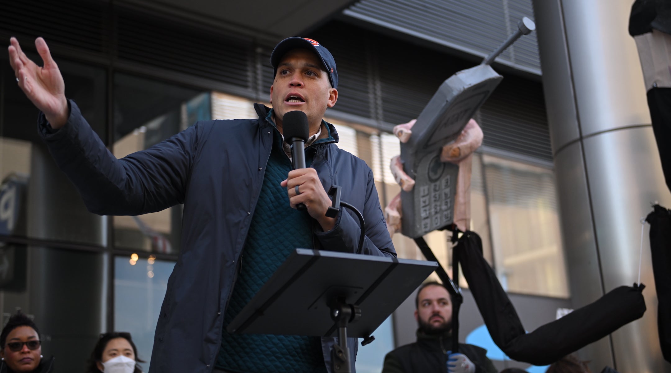 Robert Peters speaks at an anti-ICE rally