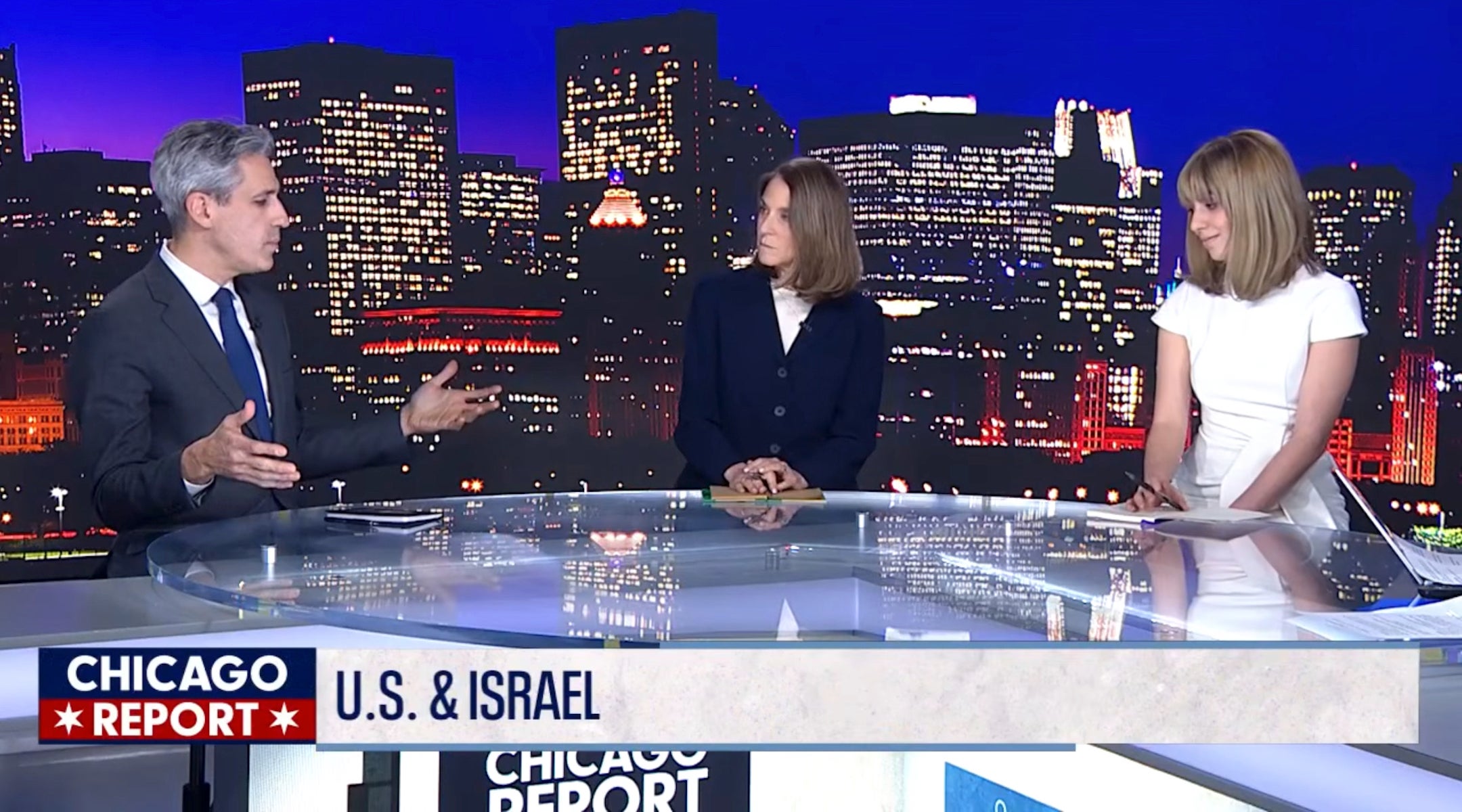 Candidates debate at a local TV news station desk