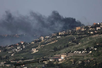 Smoke rises from Khiyam, a Lebanese village near the border with Israel, amid escalation between Iran-backed Hezbollah and Israel, and amid the U.S.-Israeli conflict with Iran, as seen from northern Israel, March 18, 2026. REUTERS/Ammar Awad