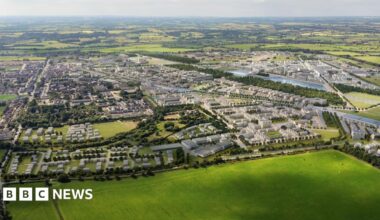 A CGI mock-up of the Heyford Park development, which is surrounded by countryside.