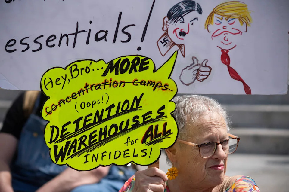 A demonstrator holds a sign during a "No Kings" protest against U.S. President Donald Trump's administration policies, in Los Angeles on March 28.