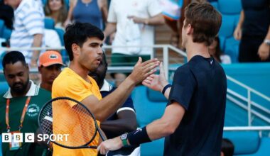 Sebastian Korda and Carlos Alcaraz embrace at the end of their match at the Miami Open