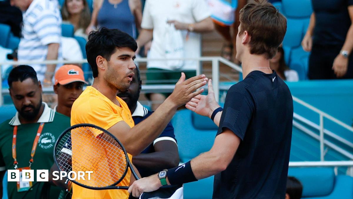 Sebastian Korda and Carlos Alcaraz embrace at the end of their match at the Miami Open