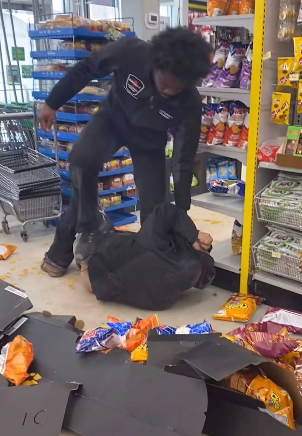 FACEBOOK
A security guard and a man are seen at Dollorama in an image from a video circulating over social media.