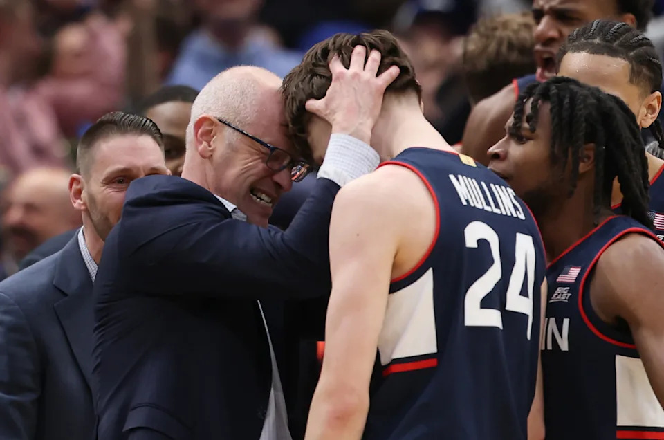 Head coach Dan Hurely celebrates with Braylon Mullins after Mullins' game-winning shot.