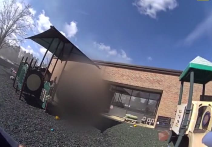 Police rescue kids, search flooded building