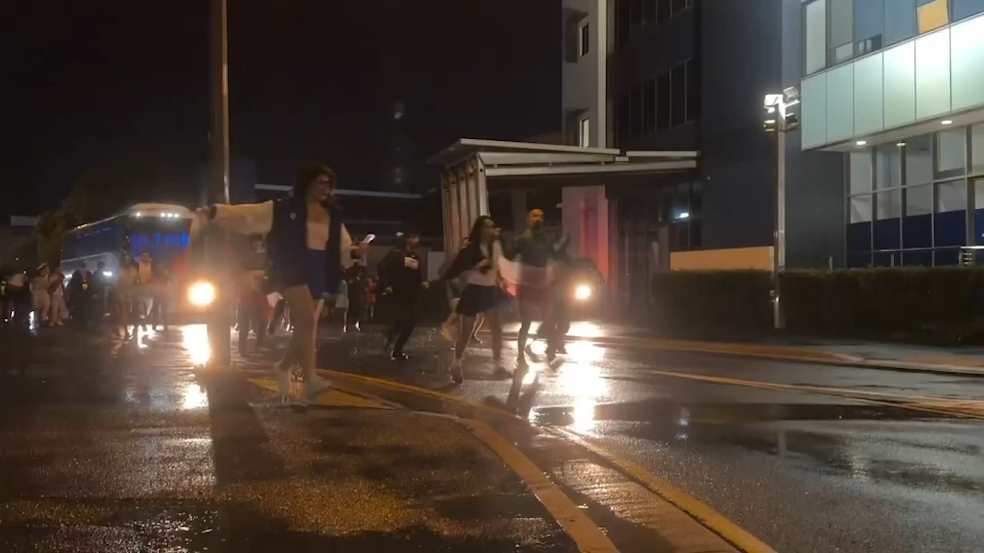 <p>Supporters surround a bus carrying the Iranian women's soccer team after their final Women's Asian Cup match on the Gold Coast, March 8, 2026.</p>
