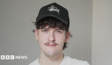 Hamish Wilson pictured at the University of Southampton where he is a student. Hamish is wearing a black cap and has dark tousled hair. He is looking to camera and is wearing a white t-shirt.